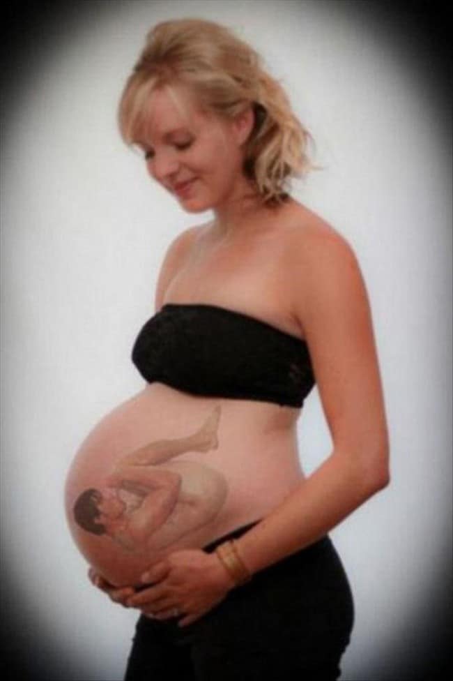 беременная женщина с рисунком на животе
