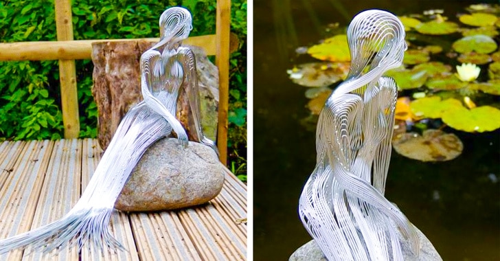 скульптура русалки, сидящей на камне
