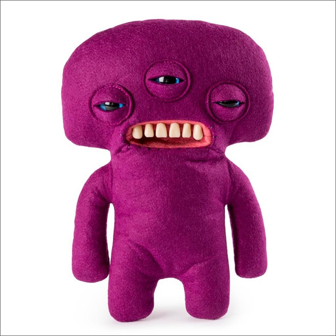фиолетовая мягкая игрушка с тремя глазами